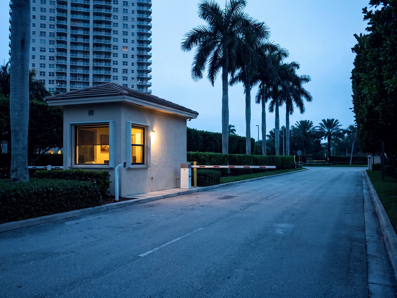 Gatehouse and vehicle barrier at the entry to a South Florida residential tower